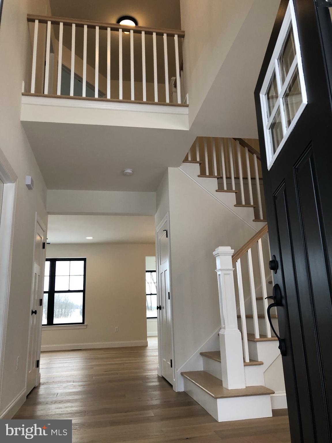 723 A Saylors Mill Road Spring City, PA 19475 - Photo 21 of 25 a view of staircase with lots of frames on wall and a window