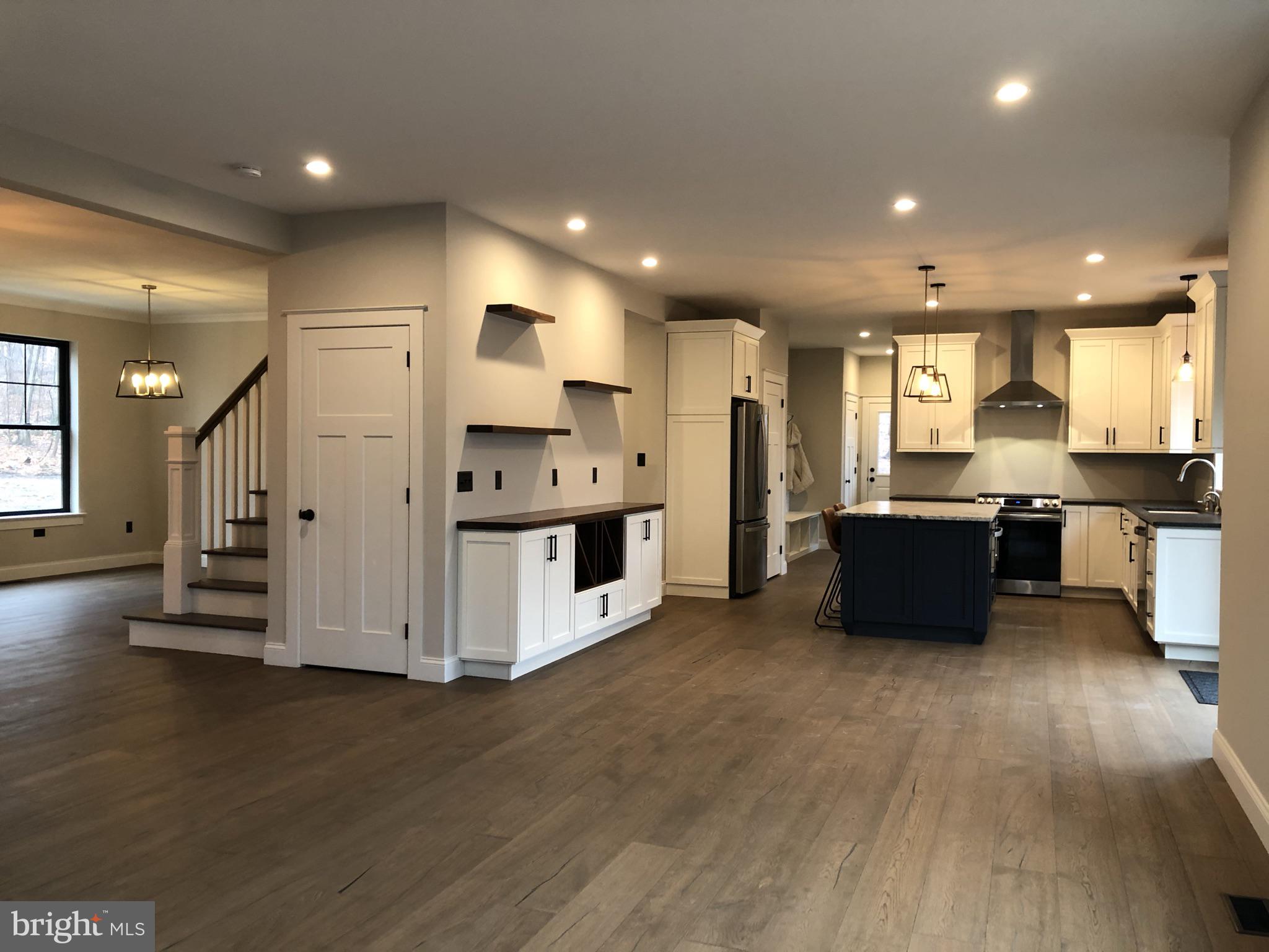 723 A Saylors Mill Road Spring City, PA 19475 - Photo 23 of 25 a large kitchen with stainless steel appliances a refrigerator a sink a stove and white cabinets