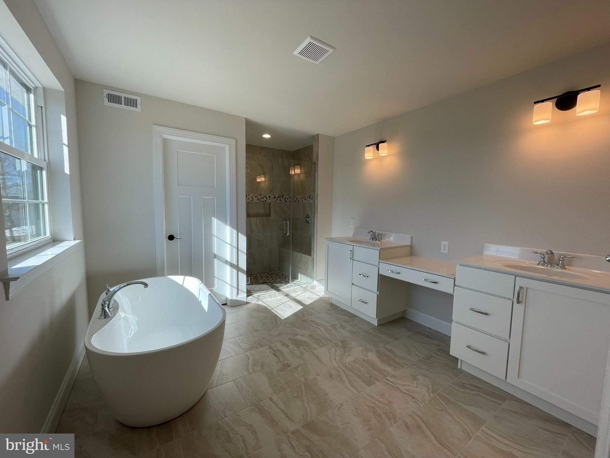 723 A Saylors Mill Road Spring City, PA 19475 - Photo 24 of 25 a bathroom with a tub sink and mirror