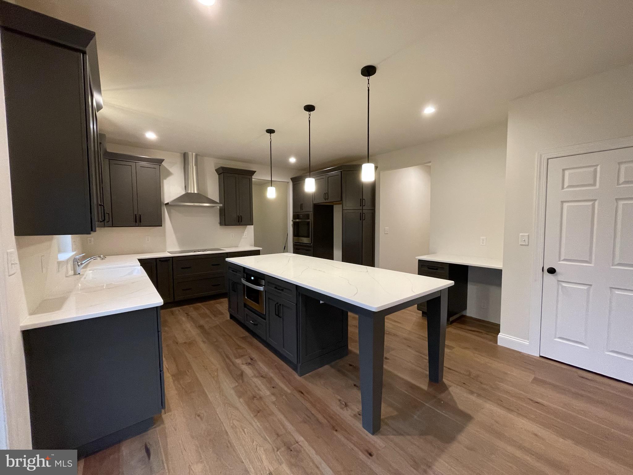 723 A Saylors Mill Road Spring City, PA 19475 - Photo 4 of 25 a large kitchen with a table and chairs