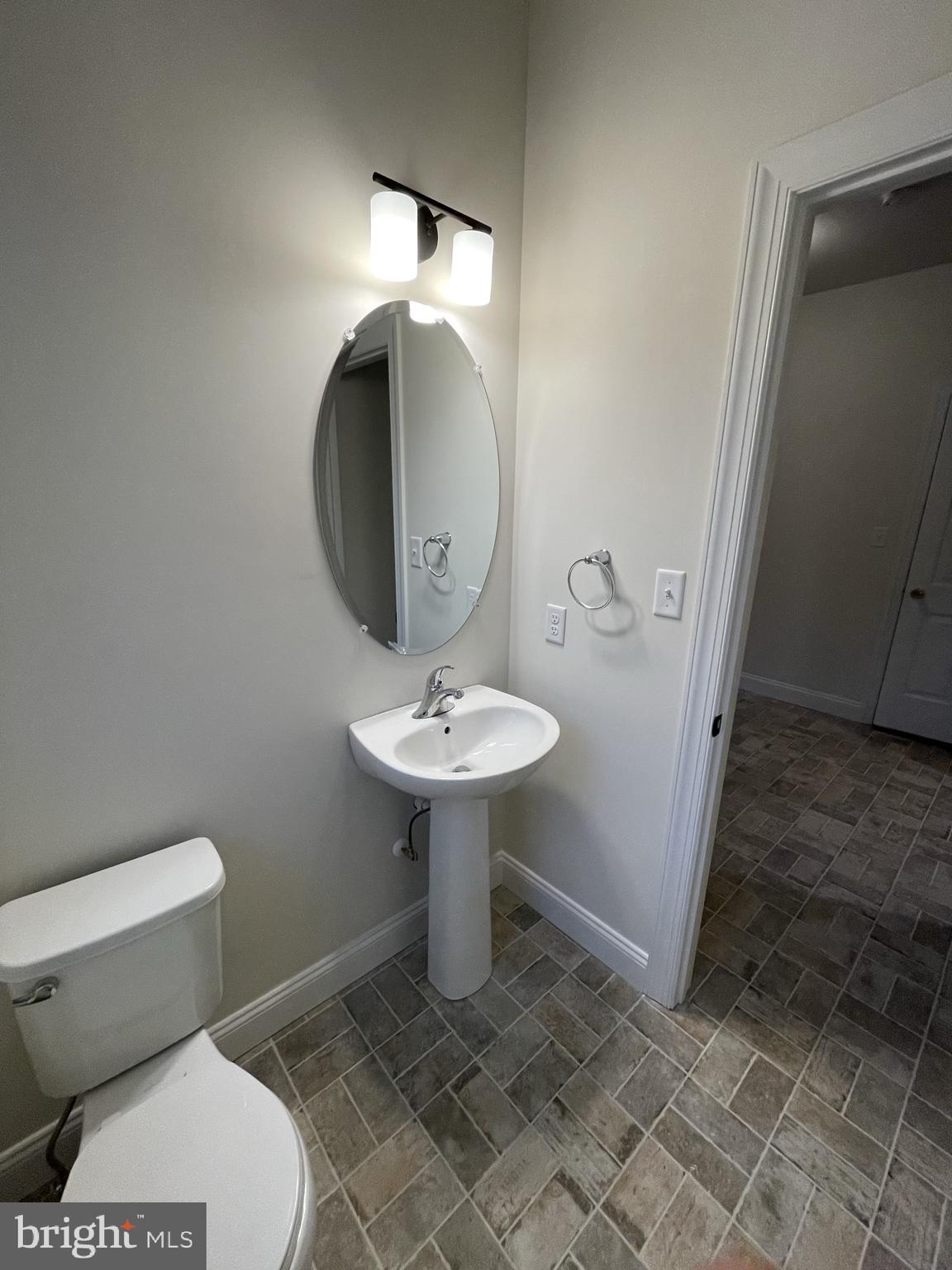 723 A Saylors Mill Road Spring City, PA 19475 - Photo 8 of 25 a bathroom with a toilet sink and mirror