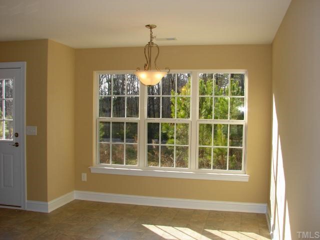 212 Orkney Road, Unit LOT13 Stem, NC 27581 - Photo 5 of 12 a view of a windows and a chandelier