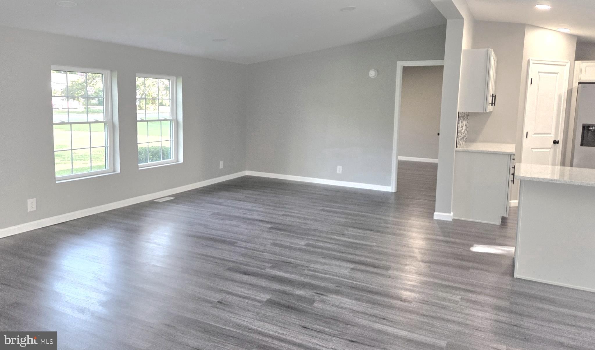 4208 Ridge Crest Road Hurlock, MD 21643 - Photo 13 of 29 Living room into Primary Ensuite