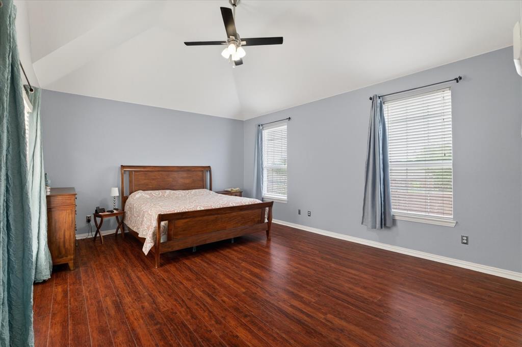 8708 Rugby Road Irving, TX 75063 - Photo 17 of 39 This spacious room features vaulted ceilings, hardwood floors, and two windows providing natural light