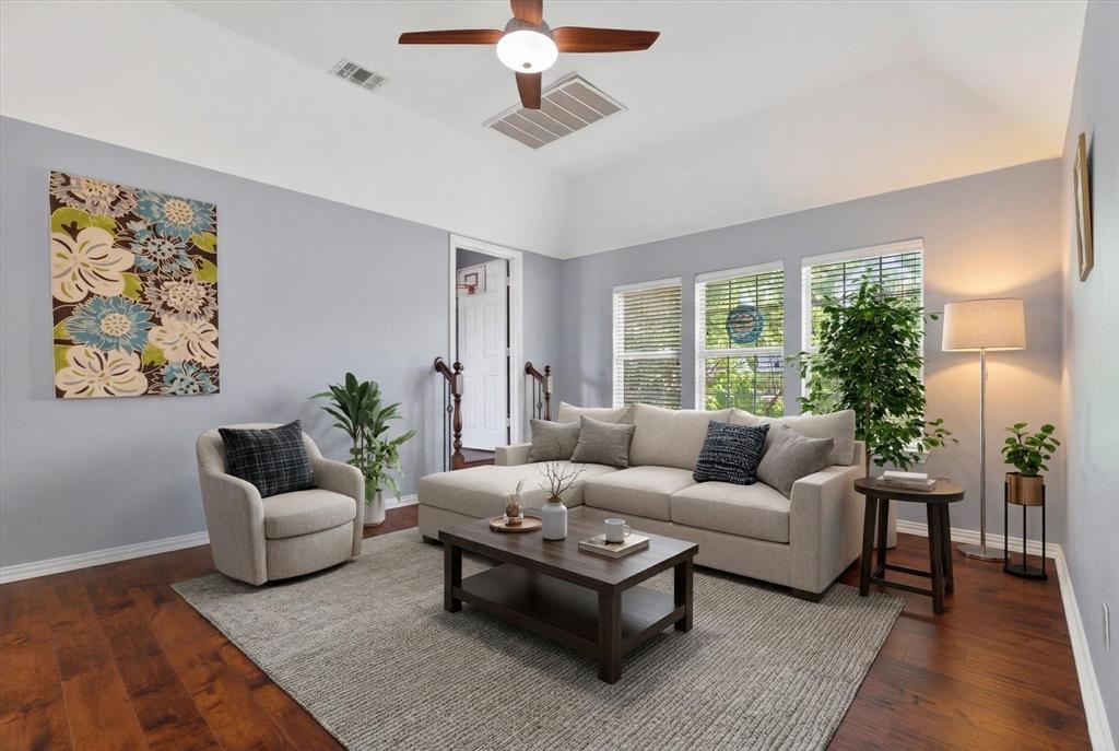 8708 Rugby Road Irving, TX 75063 - Photo 24 of 39 Living area with vaulted ceilings, a ceiling fan, and hardwood flooring