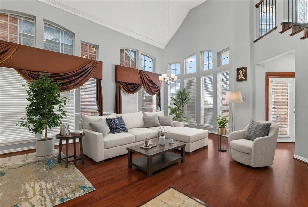 8708 Rugby Road Irving, TX 75063 - Photo 7 of 39 Living area featuring high ceilings, hardwood floors, and large windows with blinds