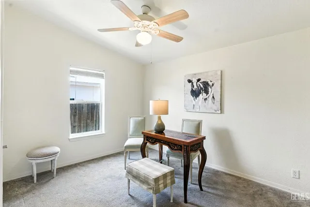 a bedroom with furniture and flat screen tv