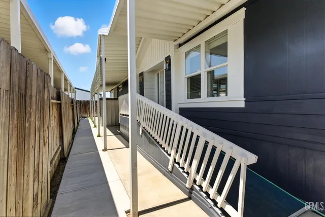 an aerial view of residential houses with city view