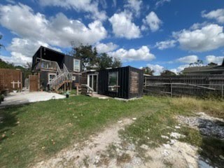 609 Firnat Street Houston, TX 77022 - Photo 3 of 10 a view of a garden with a bench in the patio
