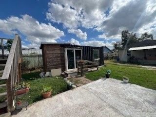 609 Firnat Street Houston, TX 77022 - Photo 7 of 10 a view of house with yard and entertaining space