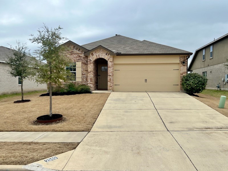 2949 Bridekirk Drive Round Rock, TX 78664 - Photo 1 of 1 a front view of a house with a yard