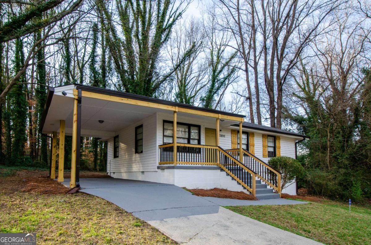 2895 Akron Street Atlanta, GA 30344 - Photo 1 of 1 a view of a house with a yard and large tree