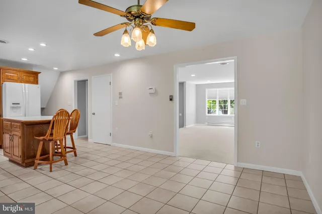 a view of a workspace with furniture and chandelier