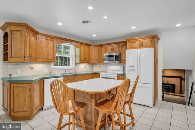 a dining table with chairs and window