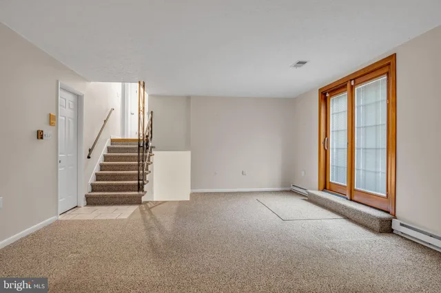 an empty room with projector and empty room