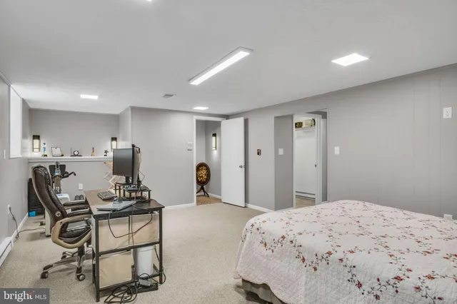 a view of storage and utility room with a fan