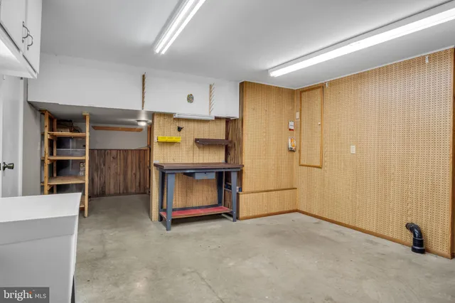 a view of kitchen with furniture and wooden floor