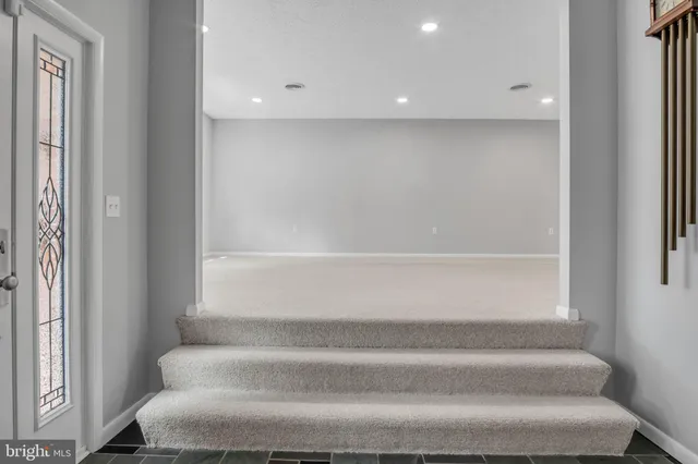 a bathroom with a bathtub and window