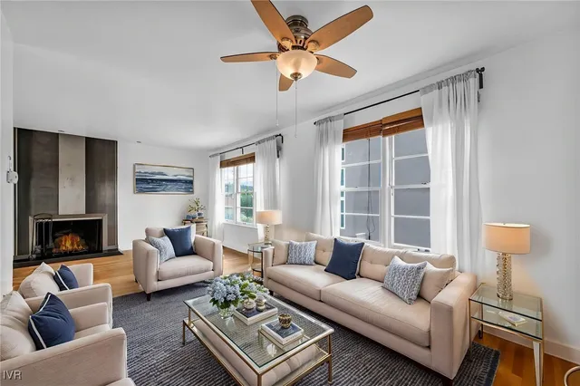 a dining room with furniture and wooden floor