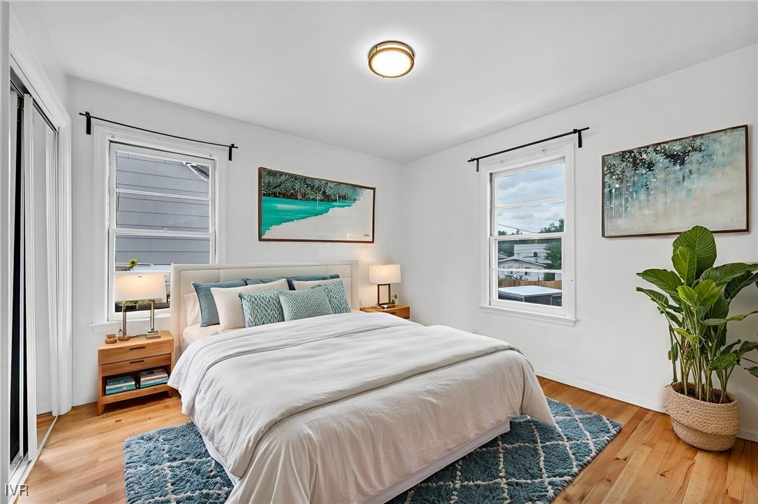 343 Mt Rose Street Reno, NV 89509 - Photo 18 of 46 a bedroom with a large bed and a potted plant