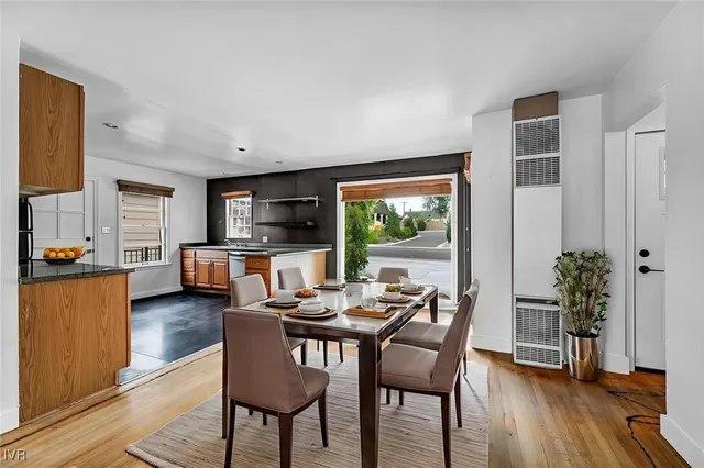 a view of kitchen with wooden floor electronic appliances and window