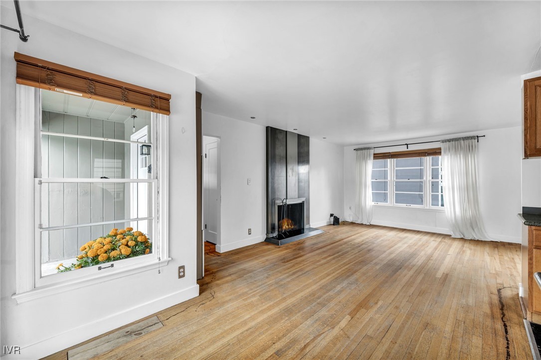 343 Mt Rose Street Reno, NV 89509 - Photo 25 of 46 an empty room with wooden floor cabinet and windows