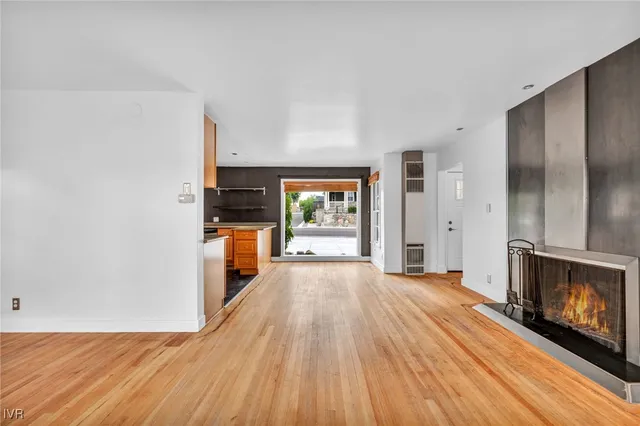 a kitchen with stainless steel appliances granite countertop a refrigerator stove and microwave