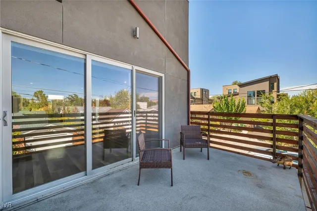 a living room with furniture a fireplace and a window