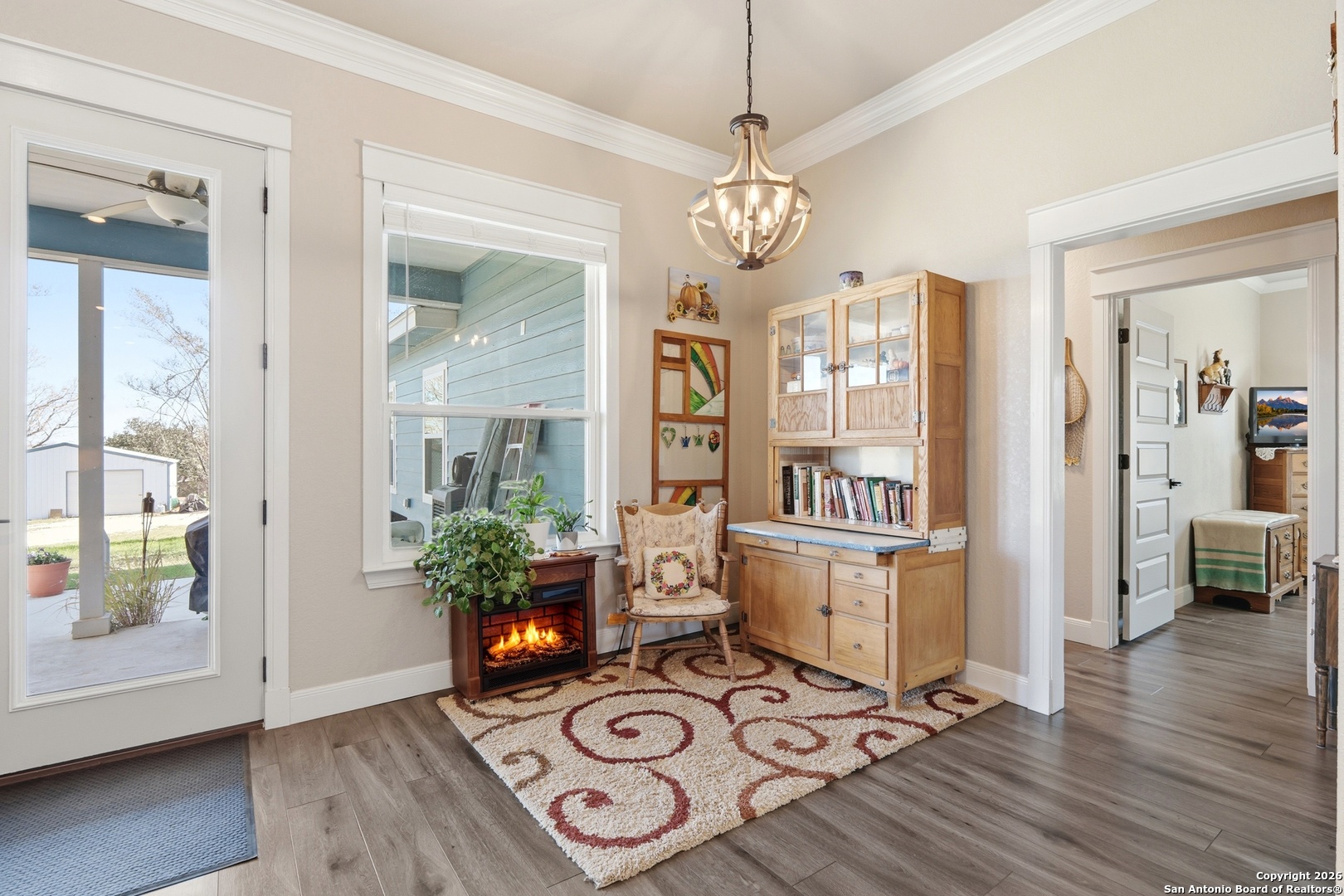 682 Stuart Road Adkins, TX 78101 - Photo 11 of 37 a view of a dining room with furniture wooden floor and chandelier