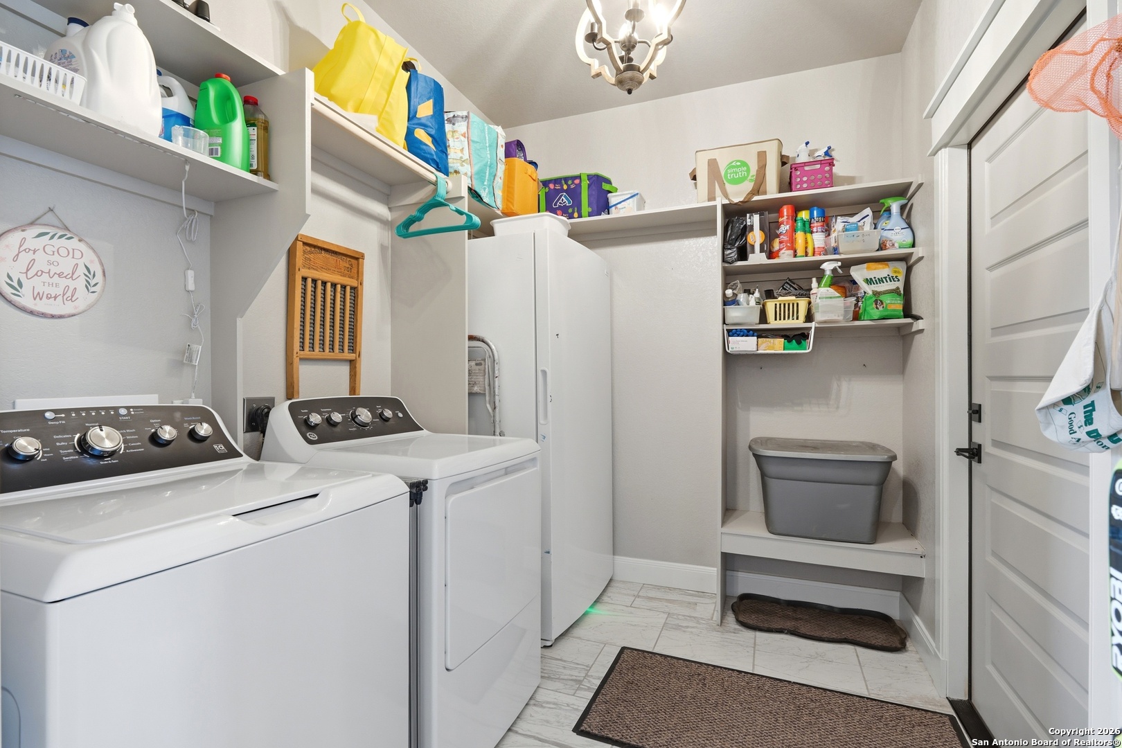 682 Stuart Road Adkins, TX 78101 - Photo 13 of 37 a utility room with dryer and washer
