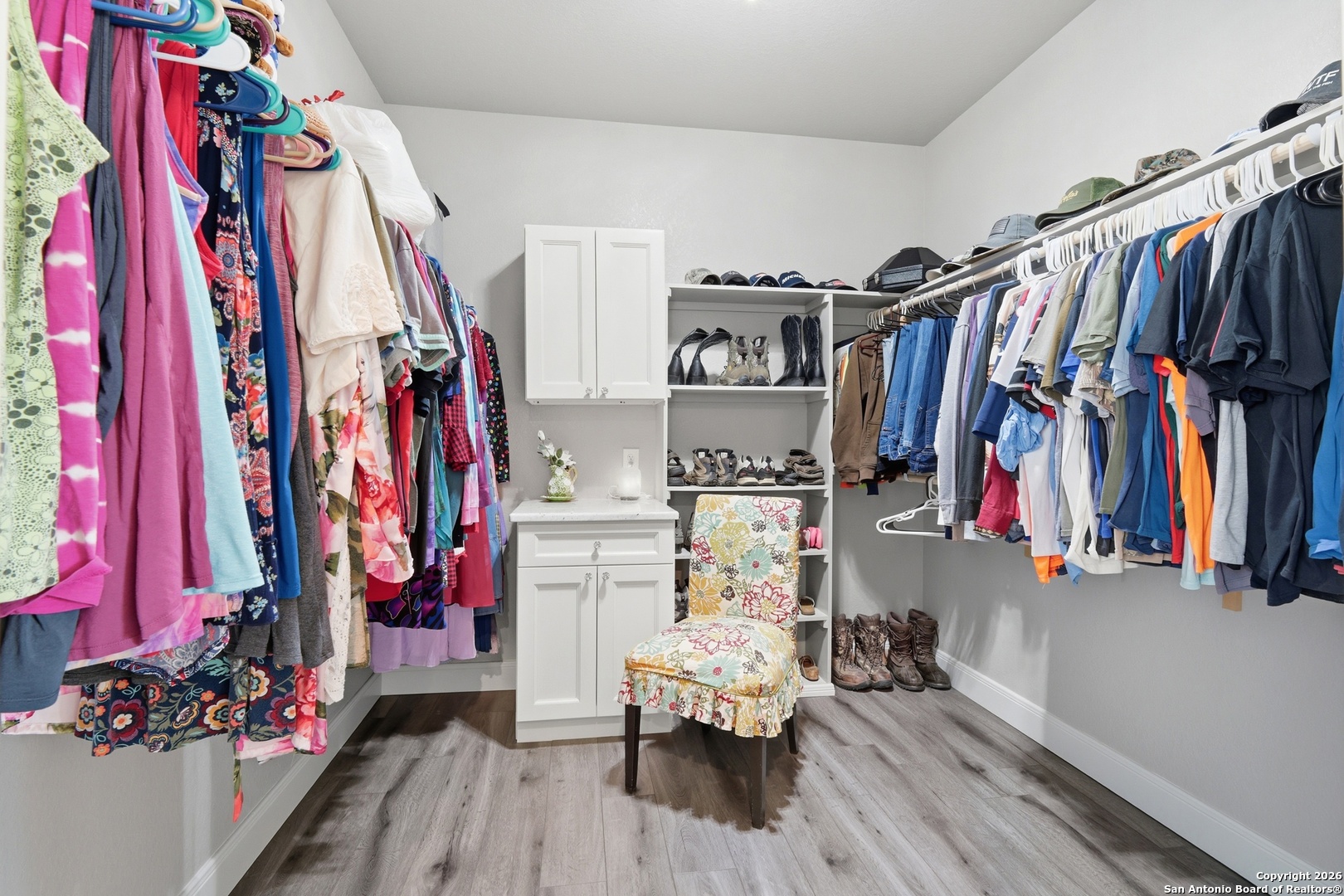 682 Stuart Road Adkins, TX 78101 - Photo 23 of 37 a view of walk in closet with clothes and shoes