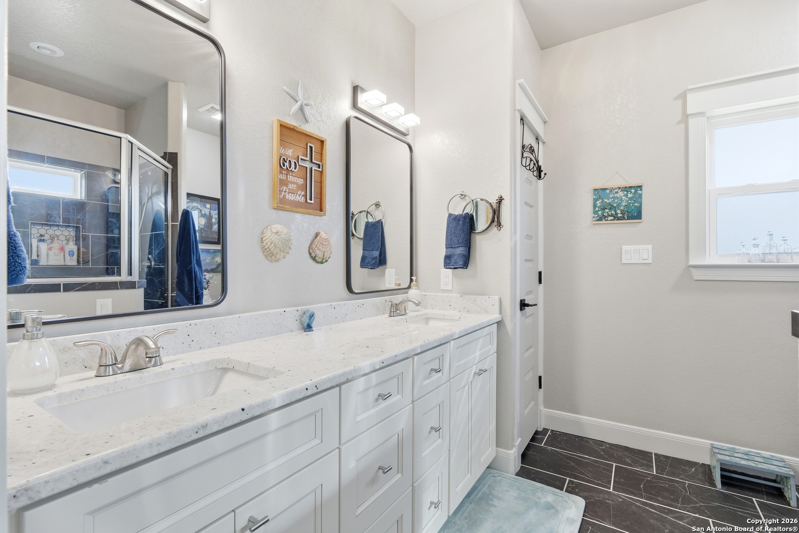 682 Stuart Road Adkins, TX 78101 - Photo 24 of 37 a bathroom with a granite countertop sink mirror and double