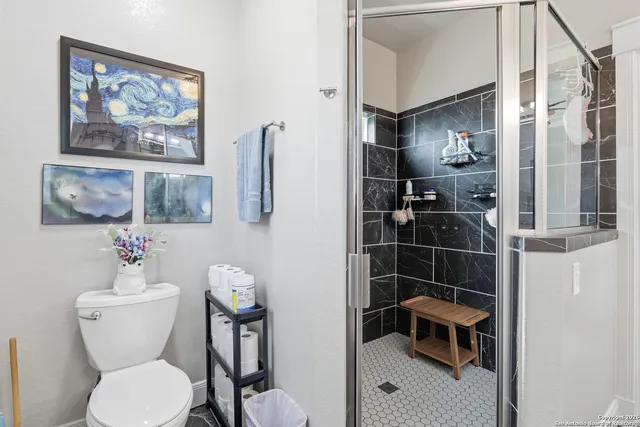 a view of a porch with furniture and garden