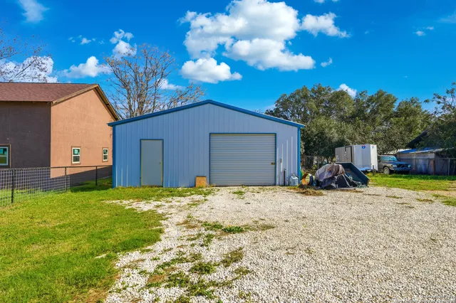 a view of a garage with storage and utility