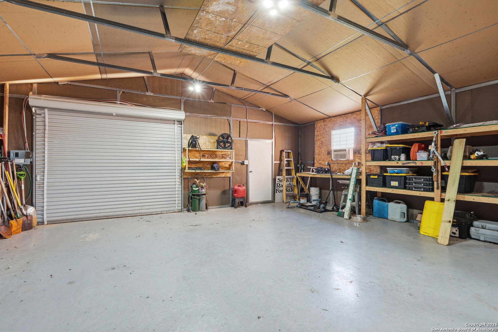 682 Stuart Road Adkins, TX 78101 - Photo 30 of 37 a view of a garage with storage
