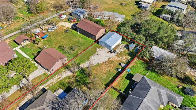 an aerial view of residential houses with outdoor space
