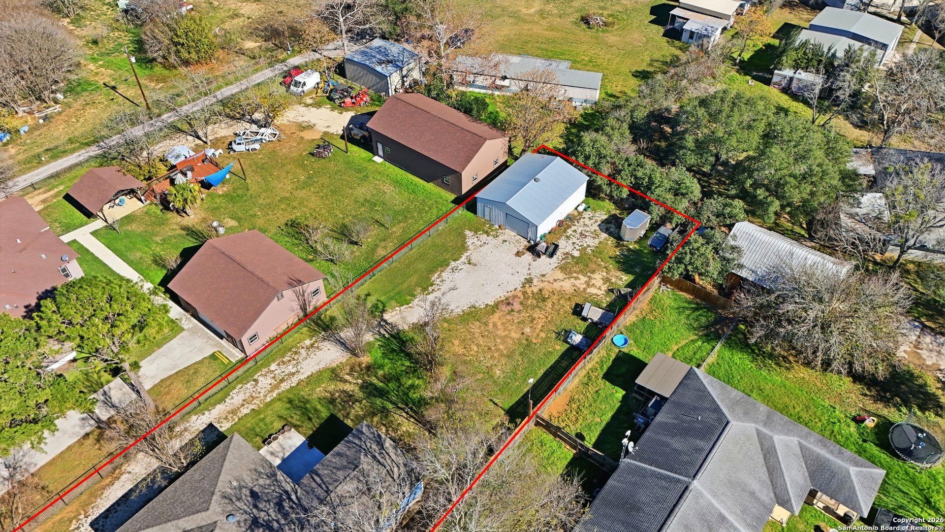 682 Stuart Road Adkins, TX 78101 - Photo 34 of 37 an aerial view of a house with a yard and garden