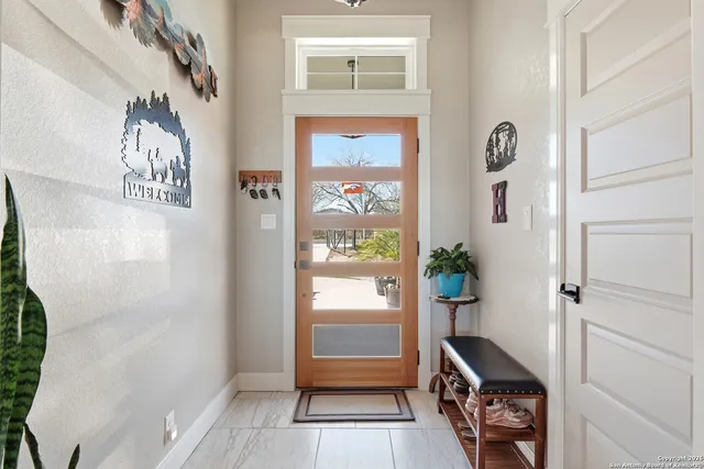 a hallway with painting on the wall