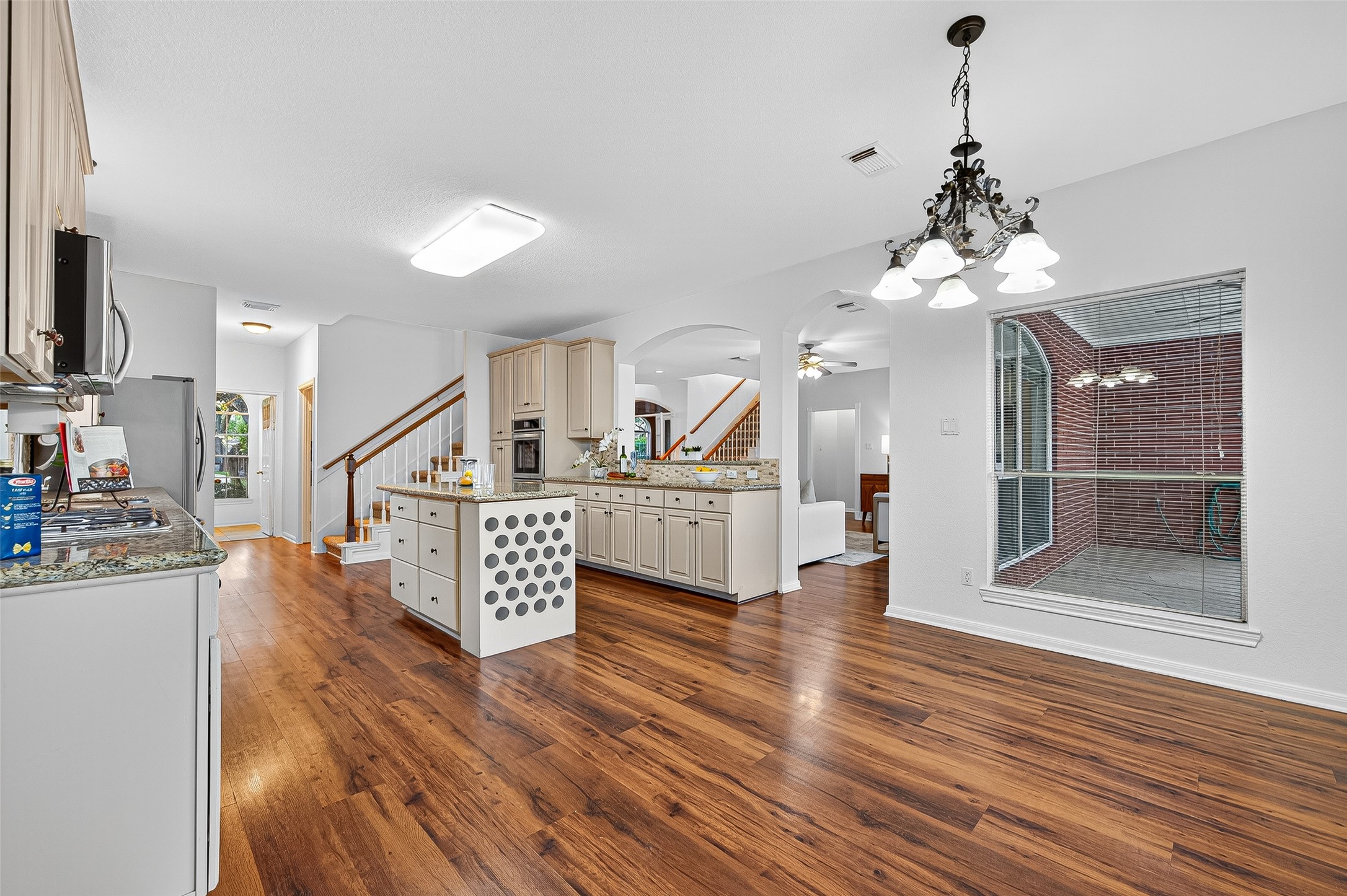 13011 Mossy Ridge Cove Houston, TX 77041 - Photo 15 of 50 a view of entryway and kitchen with wooden floor
