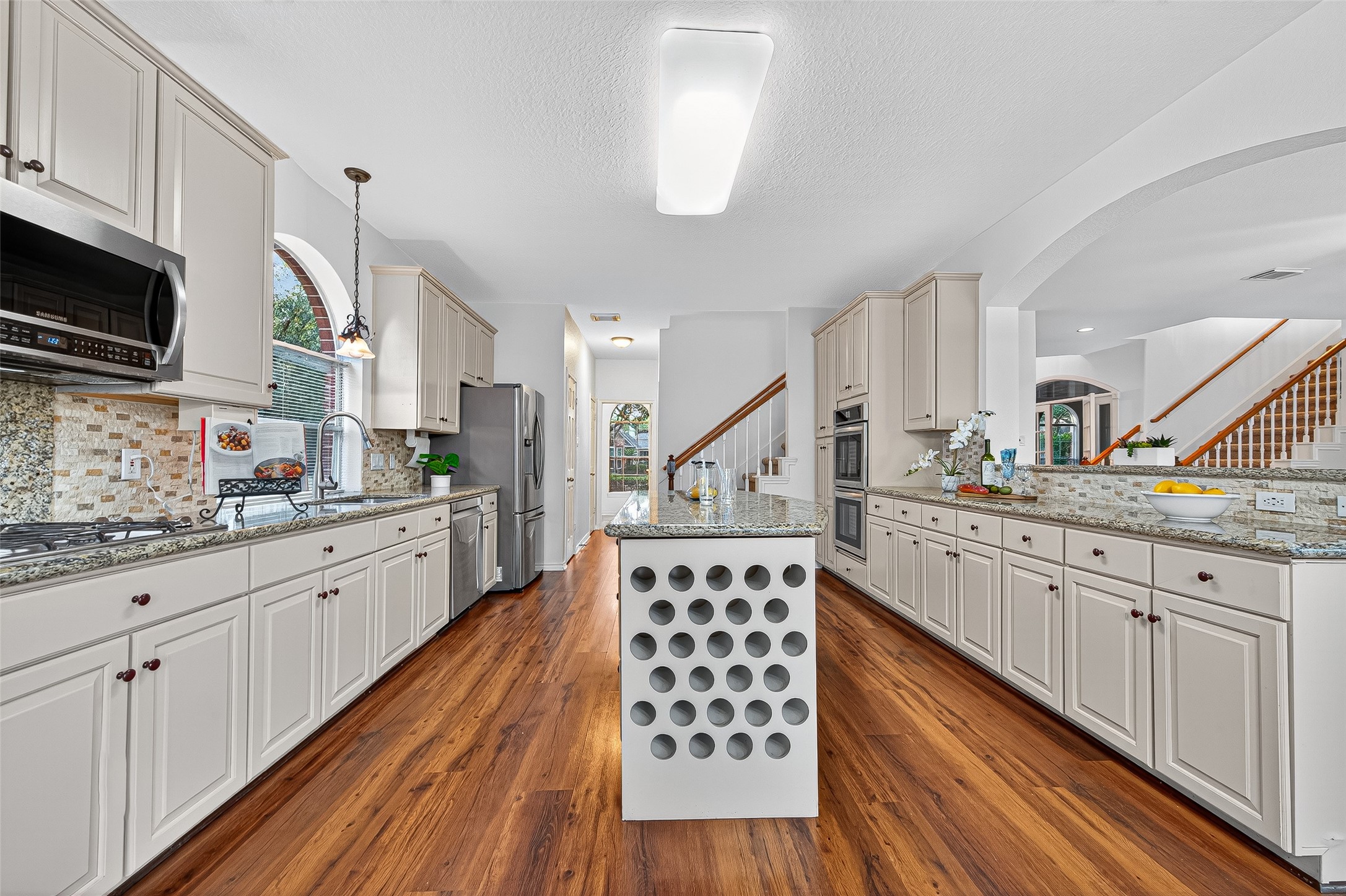 13011 Mossy Ridge Cove Houston, TX 77041 - Photo 22 of 50 a kitchen with sink cabinets and window