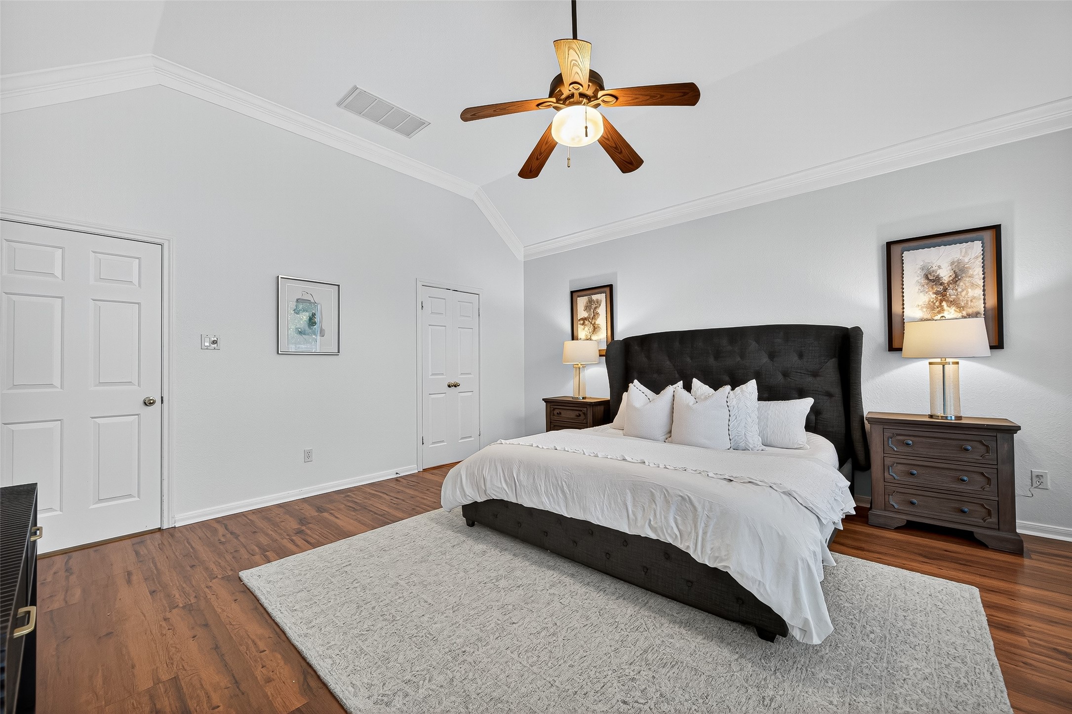 13011 Mossy Ridge Cove Houston, TX 77041 - Photo 24 of 50 a bedroom with a bed ceiling fan and a window