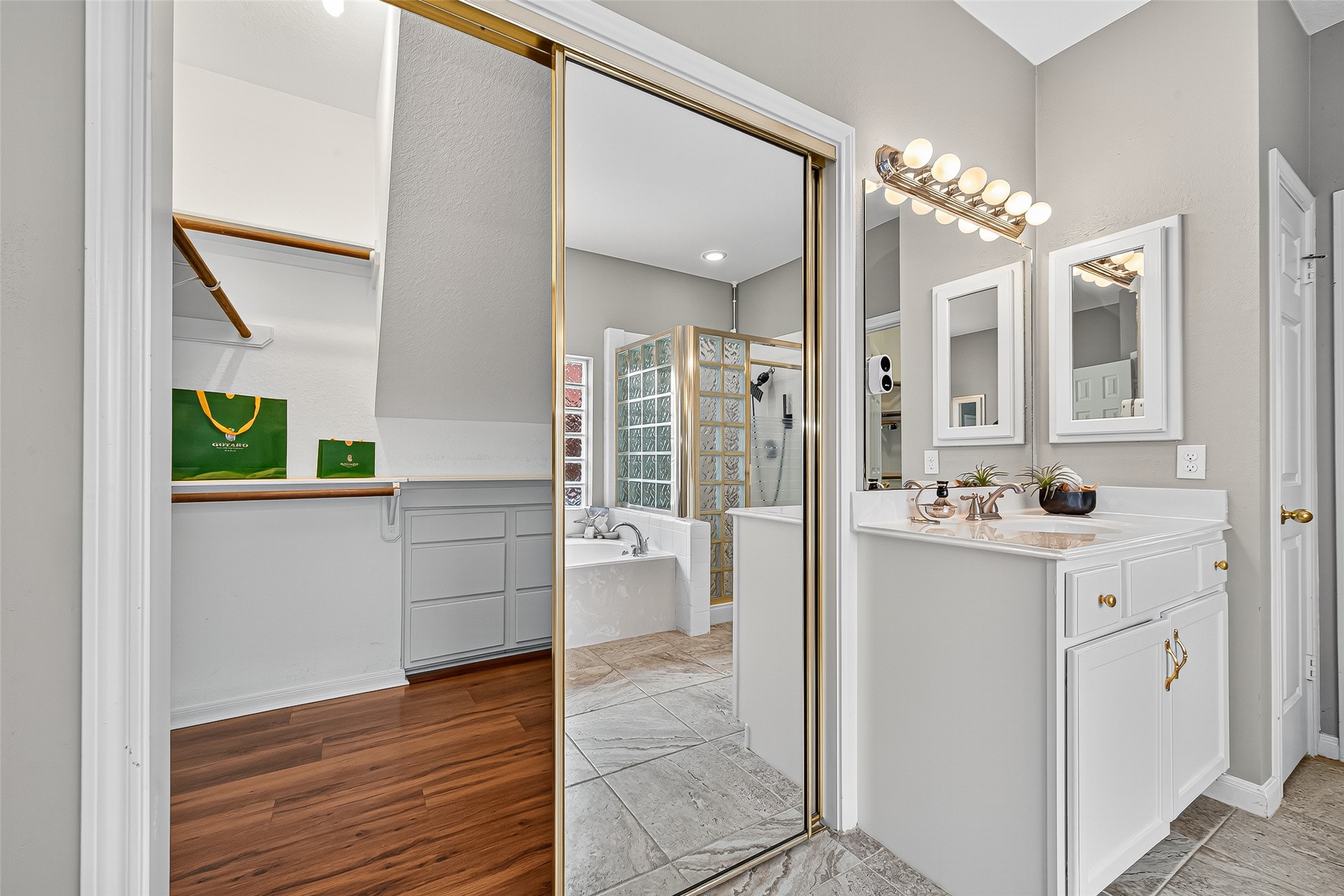 13011 Mossy Ridge Cove Houston, TX 77041 - Photo 26 of 50 a bathroom with a sink a mirror and a shower