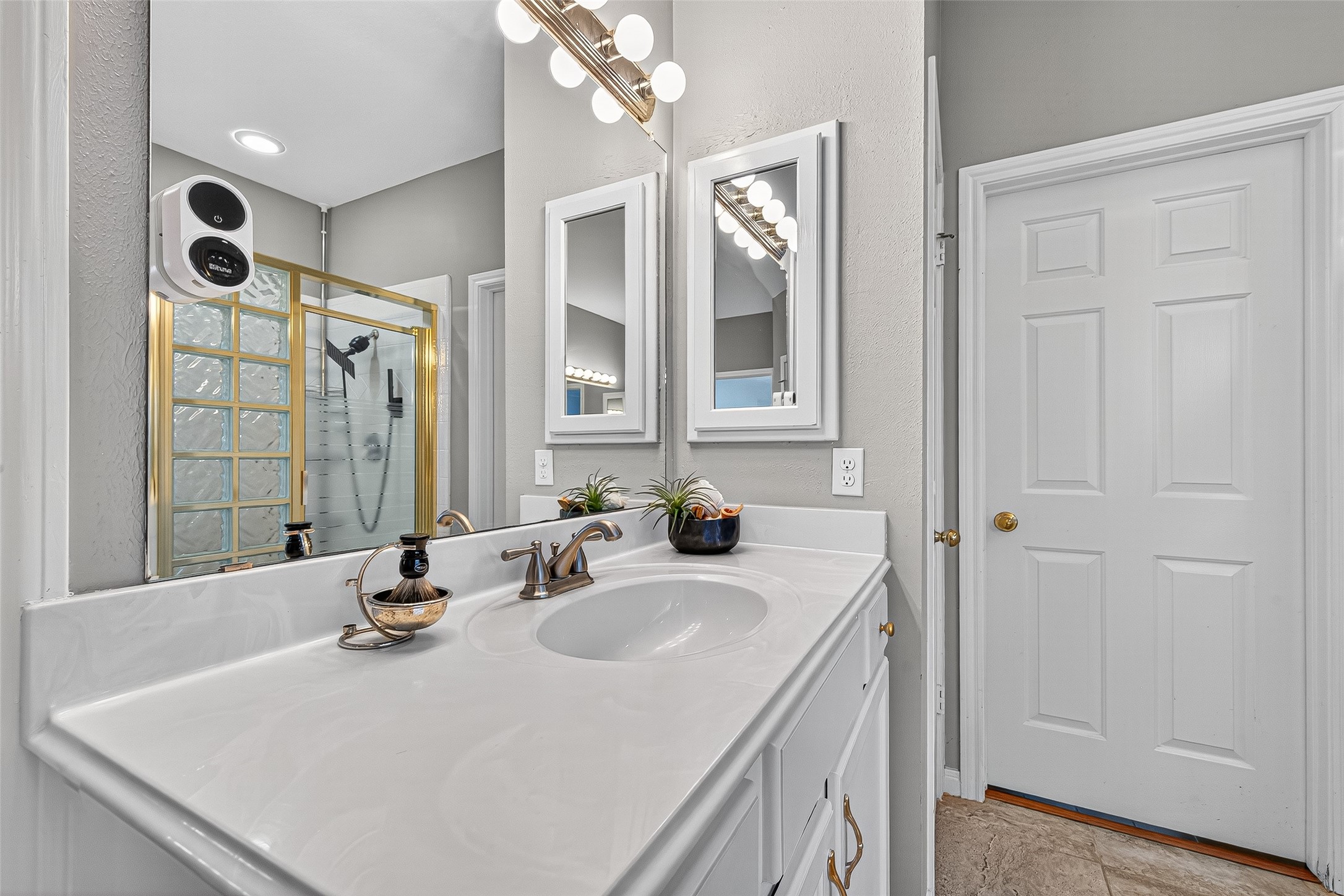 13011 Mossy Ridge Cove Houston, TX 77041 - Photo 28 of 50 a bathroom with a sink and a mirror