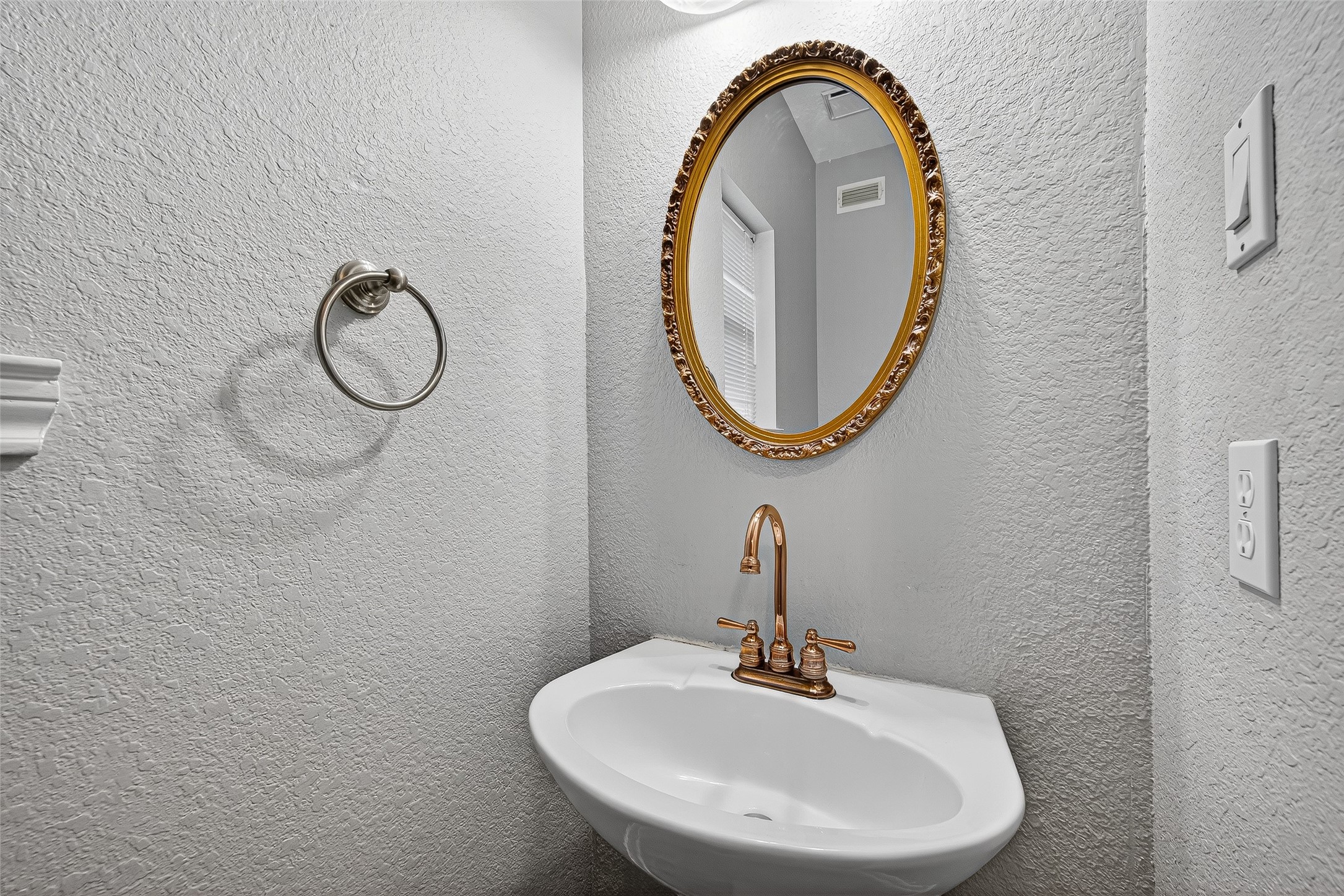13011 Mossy Ridge Cove Houston, TX 77041 - Photo 32 of 50 a bathroom with a sink and a mirror