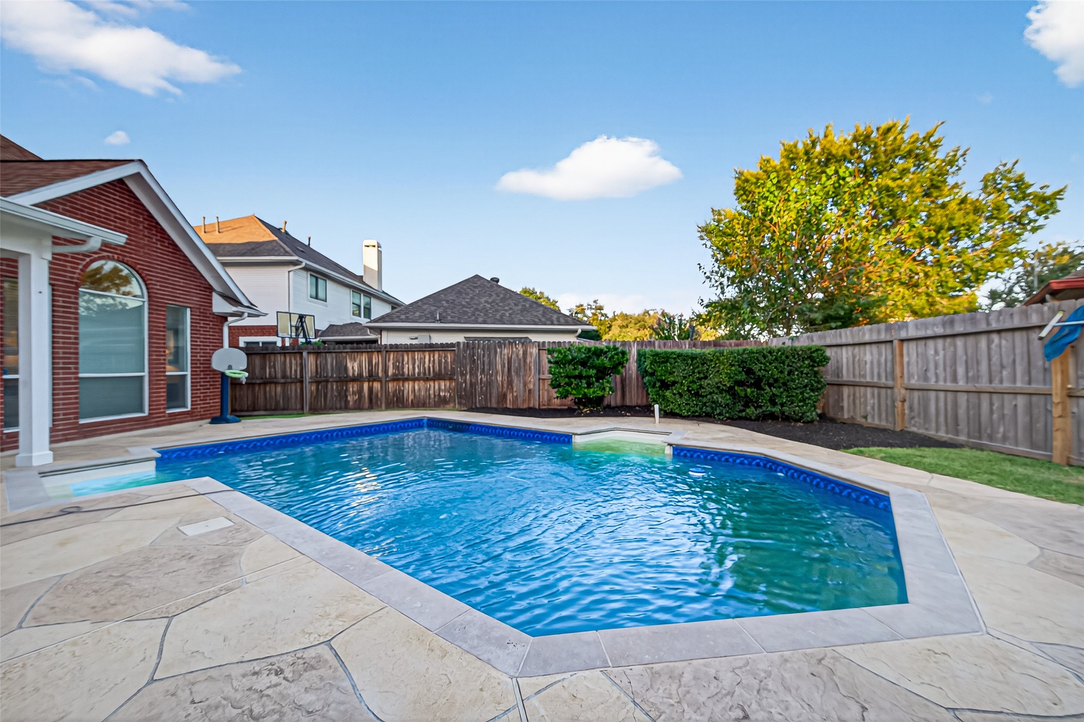 13011 Mossy Ridge Cove Houston, TX 77041 - Photo 42 of 50 a view of a swimming pool with a patio