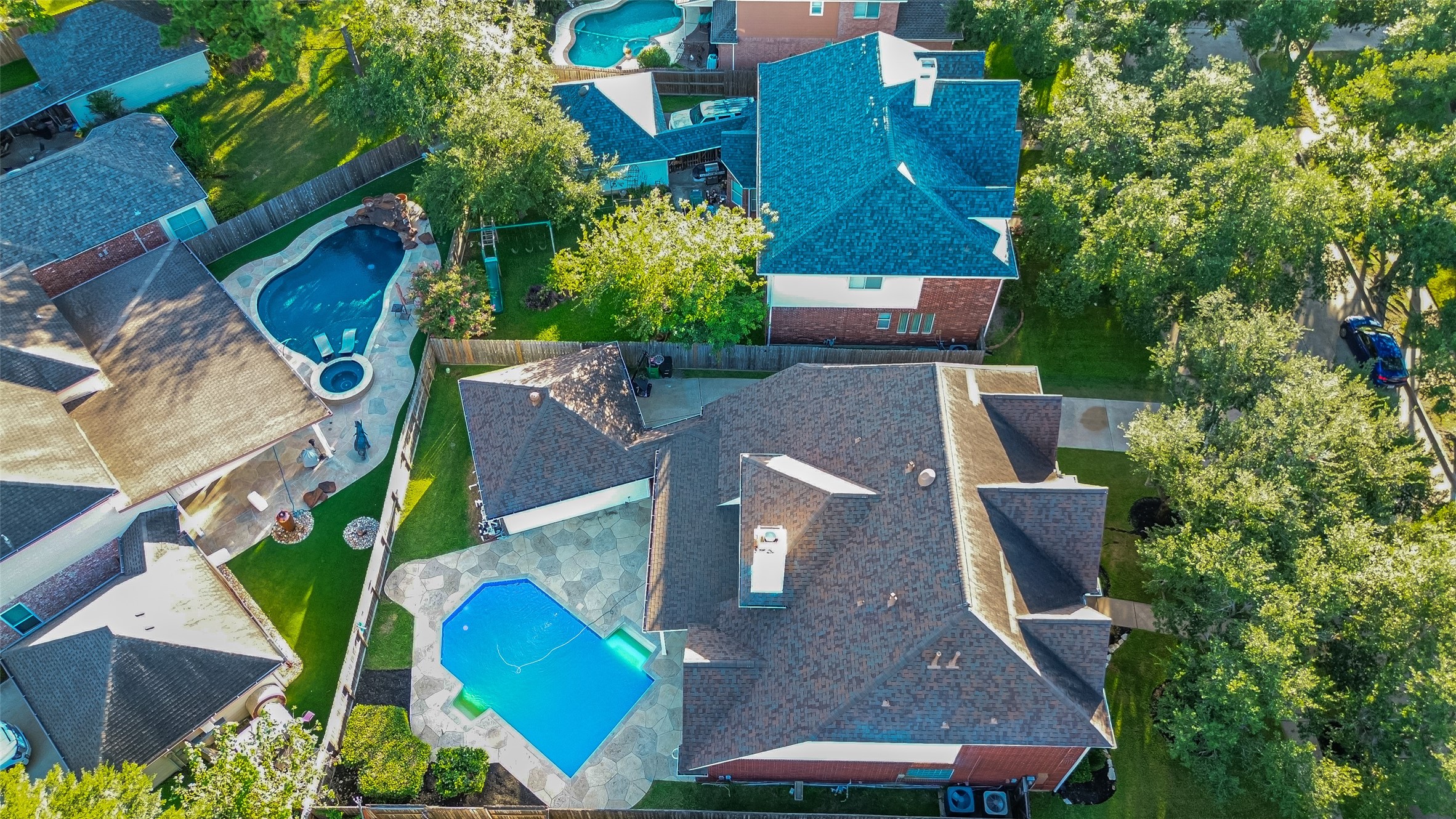 13011 Mossy Ridge Cove Houston, TX 77041 - Photo 47 of 50 an aerial view of house with yard swimming pool and outdoor seating