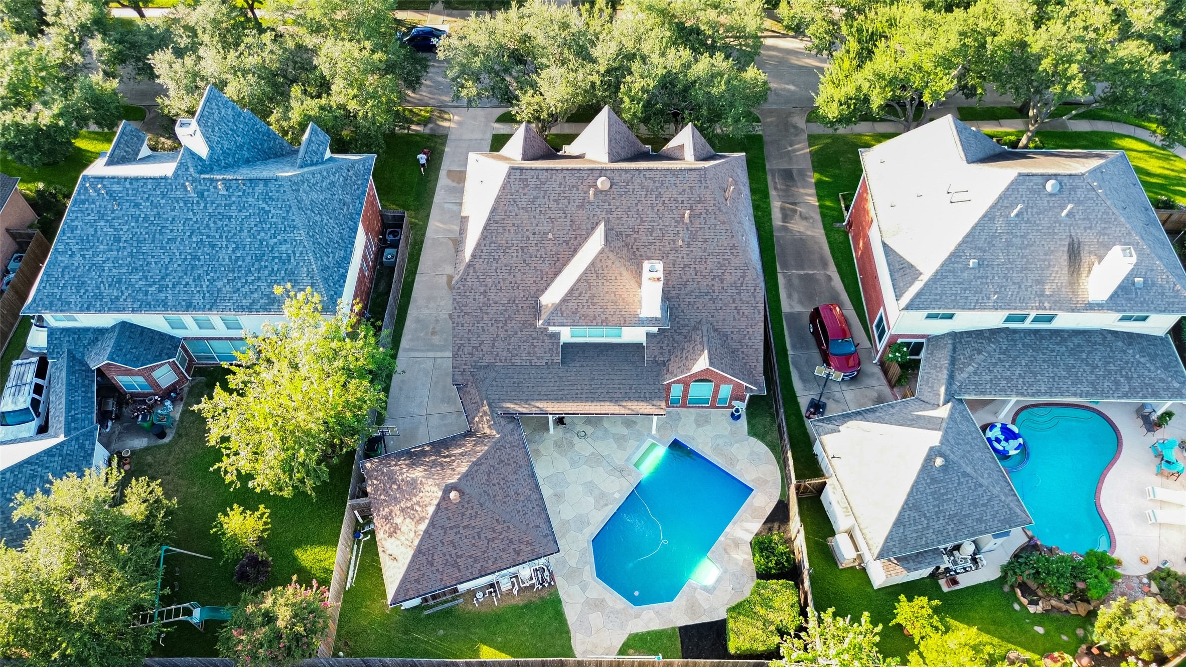 13011 Mossy Ridge Cove Houston, TX 77041 - Photo 48 of 50 an aerial view of a house with swimming pool and big yard
