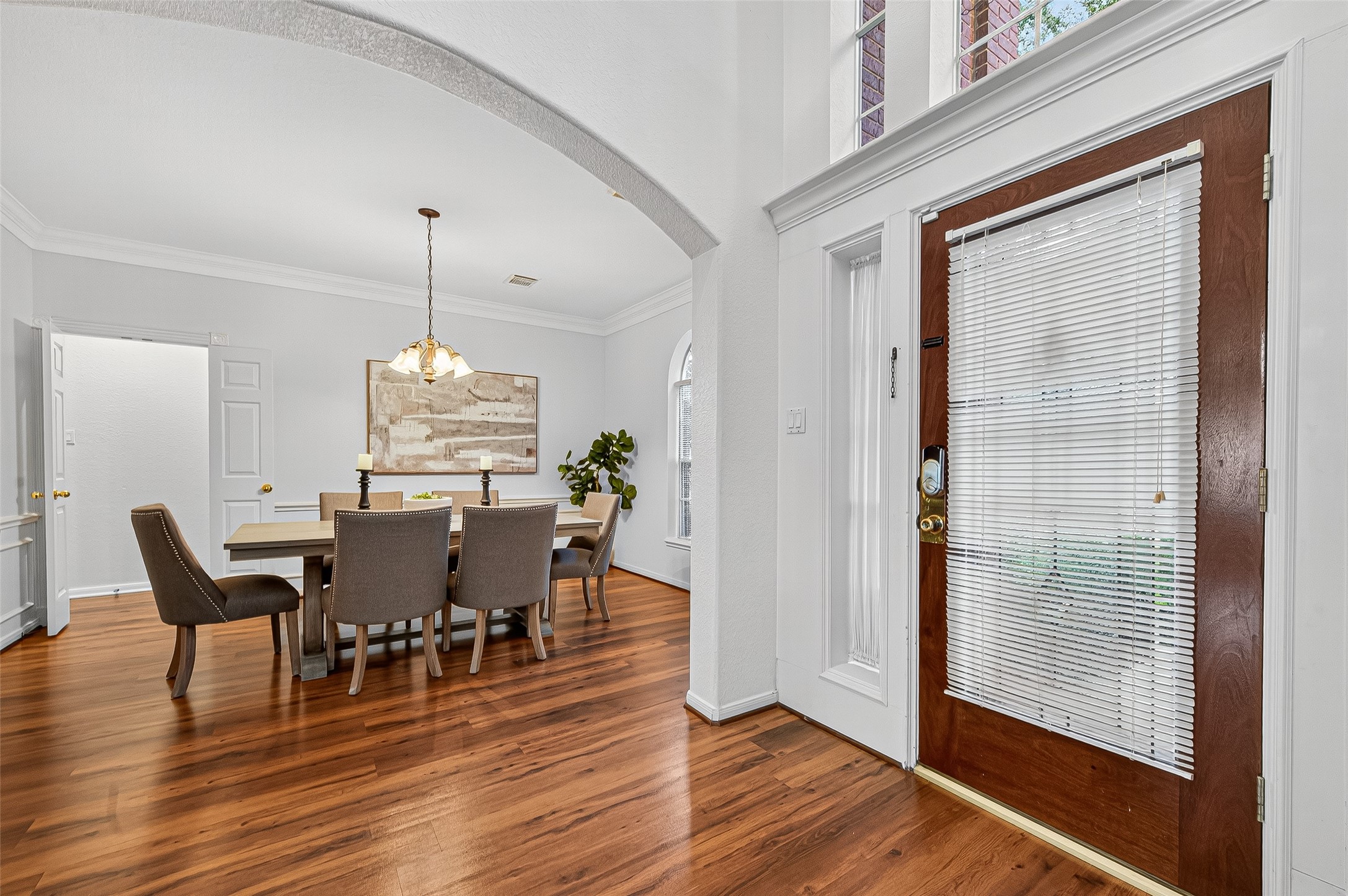 13011 Mossy Ridge Cove Houston, TX 77041 - Photo 6 of 50 a view of a dining room with furniture wooden floor and chandelier