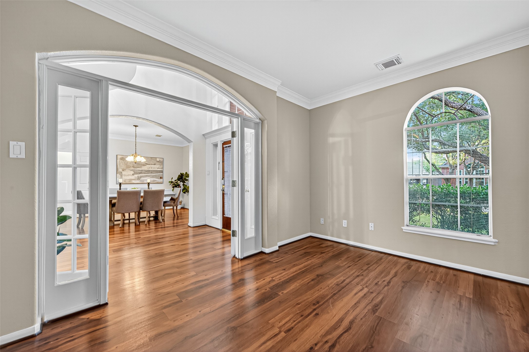 13011 Mossy Ridge Cove Houston, TX 77041 - Photo 9 of 50 an empty room with wooden floor and a window