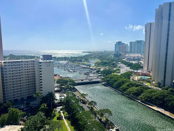 an aerial view of city and lake